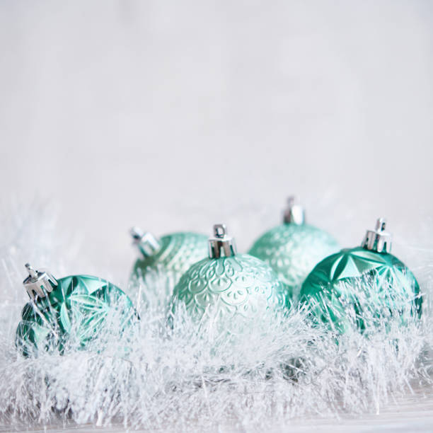 istock Christmas Background with Teal Green Ornaments and Tinsel 1288511349