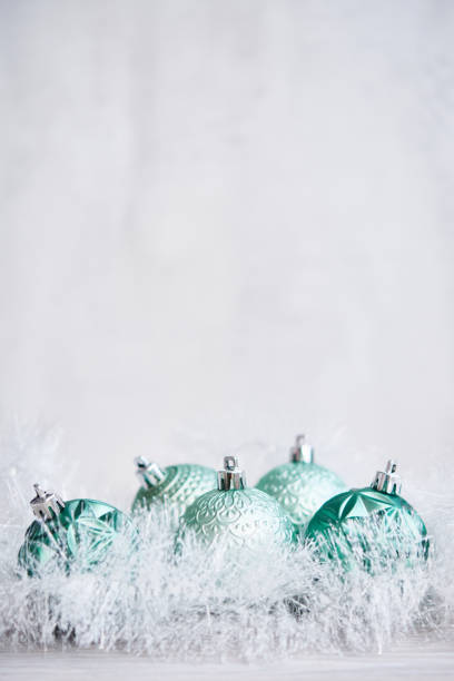 istock Christmas Background with Teal Green Ornaments and Tinsel 1288511375