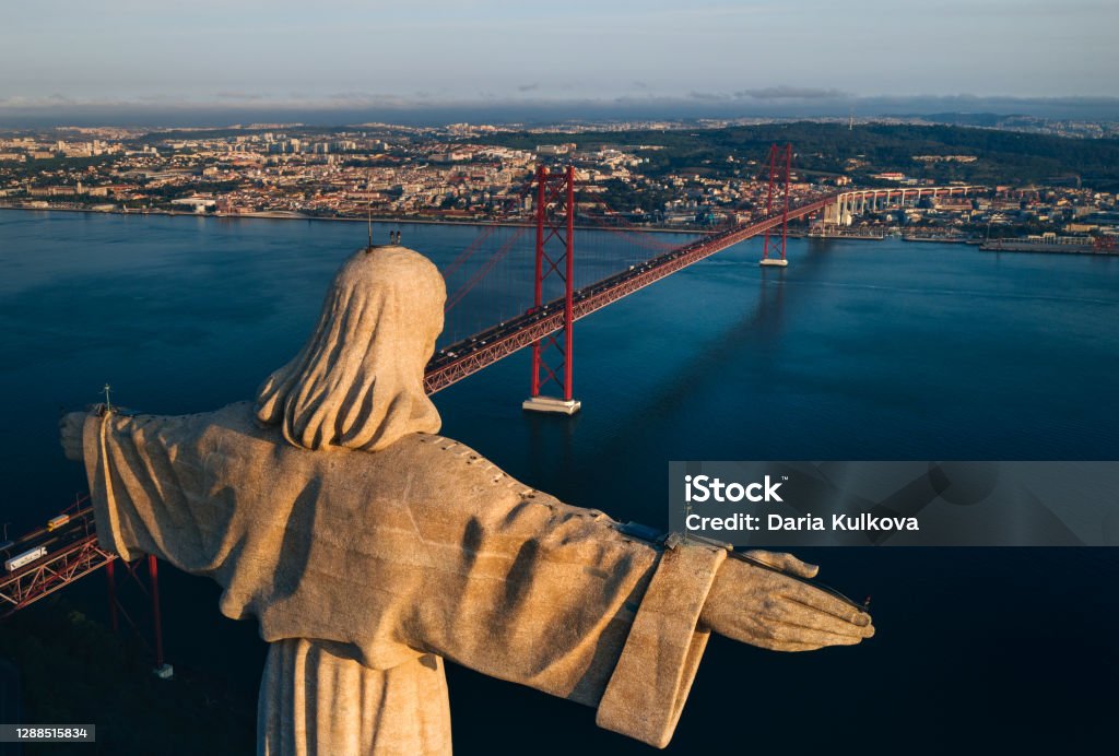 Aerial view of Sanctuary of Christ the King, Santuario de Cristo Rei. Drone photo at sunrise. Sightseeing in Portugal, Lisbon Aerial view of Sanctuary of Christ the King, Santuario de Cristo Rei. Drone photo at sunrise. Sightseeing in Portugal, Lisbon. High quality photo Lisbon Stock Photo