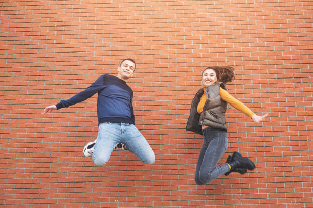 istock Happy friend jumping on outside 1288518832