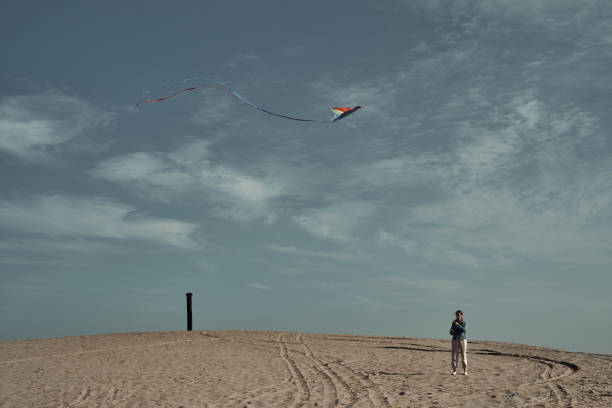 istock The girl launches a kite. Camping, hobby. 1288521673