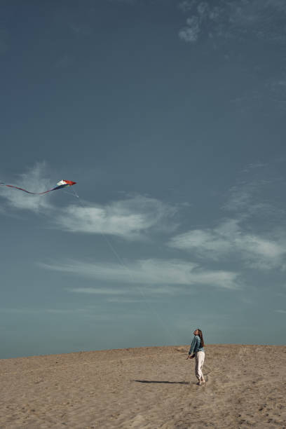 istock The girl launches a kite. Camping, hobby. 1288521681