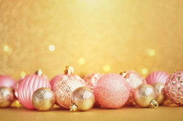 istock Glittering Christmas Background with Pink and Gold Decorations 1288521691