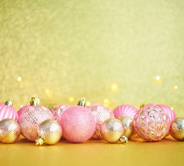 istock Glittering Christmas Background with Pink and Gold Decorations 1288521857