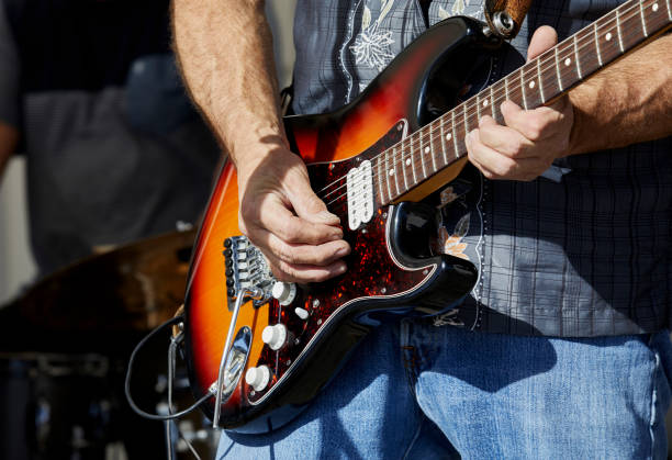 istock Musician's Hands playing and Electric Guitar 1288524328