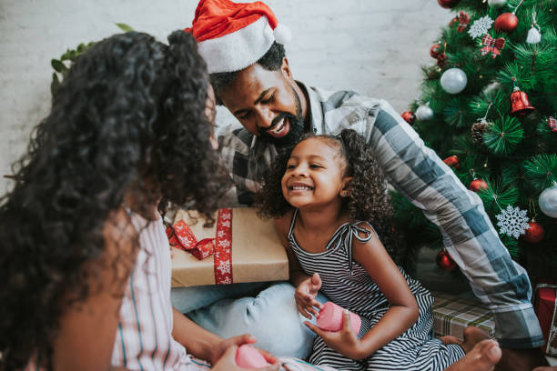 istock Child smiling while receiving Christmas gift 1288525773