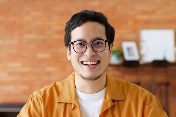 istock Portrait young confident smart Asian man look at camera and smile 1288536046