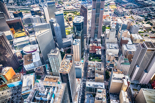 Looking down upon the streets and city blocks of downtown Dallas, Texas from about 1000 feet in altitude directly overhead.