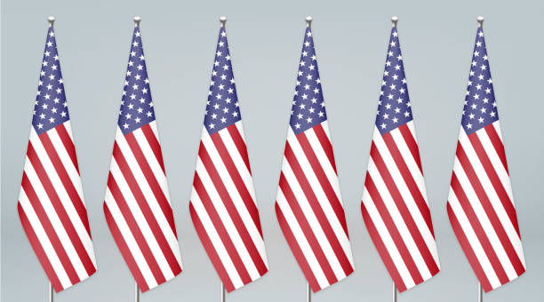 istock United States hanging flag on stand. Politic conference background 1288538723