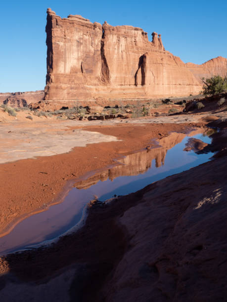 tower of babel with a pond and reflection in the foreground - desert the gossips sand rock imagens e fotografias de stock