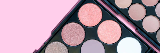 istock Beautiful colorful eyeshadow palette. Make-up. Beauty banner. Decorative cosmetics. Tool for makeup artist. Brown eye shadow. Flat lay. Closeup. Pastel trendy colors. Copy space. Place for text. 1288543590
