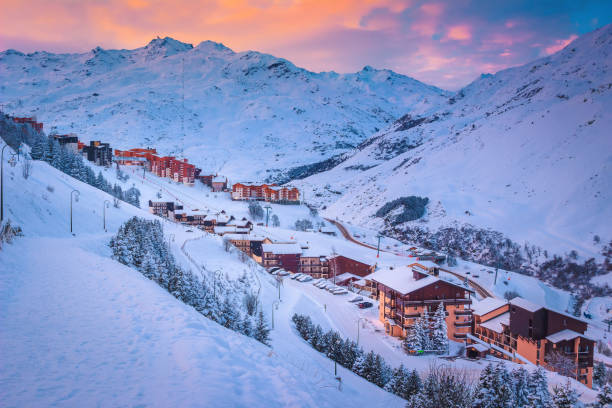 ski resort in the valley at sunrise, les menuires, france - ski resort winter snow night photos et images de collection