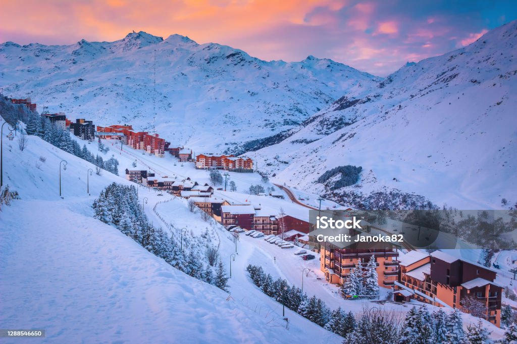 Ski resort in the valley at sunrise, Les Menuires, France Spectacular ski resort with alpine wooden buildings at sunrise, Les Menuires, 3 Vallees, France, Europe Les Menuires Stock Photo