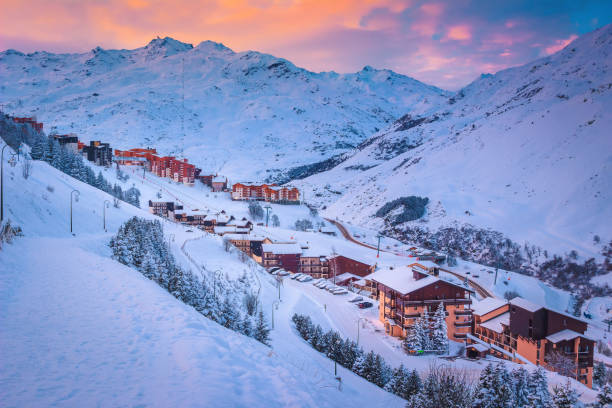 ski resort in the valley at sunrise, les menuires, france - ski resort winter snow night imagens e fotografias de stock