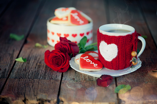 Valentine's Day Cookies and Coffee on an Old Wood Background