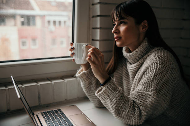 istock When it’s rain I like to sit next to the window 1288559175