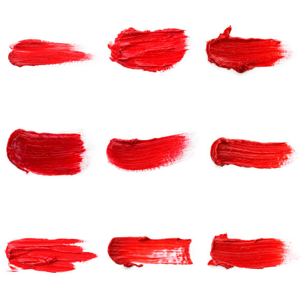 istock Lipstick smear smudge swatch isolated on white background. Cream makeup textu 1288560266