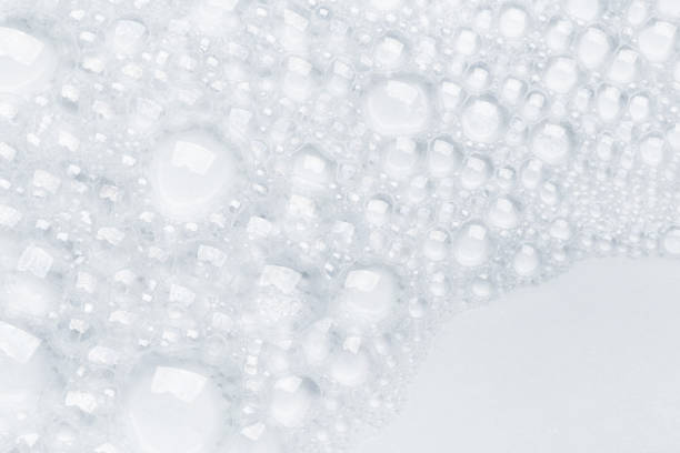 istock Abstract background white soapy foam texture. Shampoo foam with bubbles 1288560296