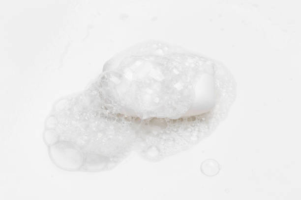 istock Soap bar and foam on white background, top view. Mockup for design 1288560343
