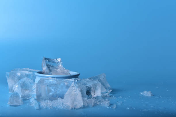 istock The bowl with ice on a blue background. Copy space 1288561278