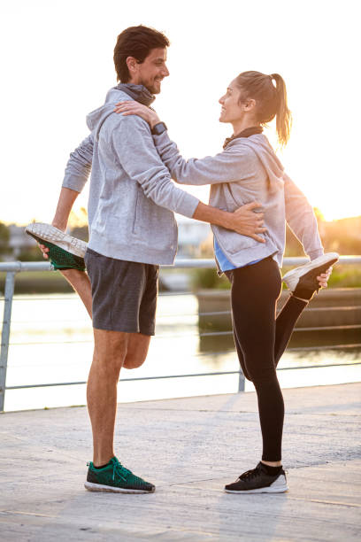 istock Couple exercising on boardwalk 1288561289