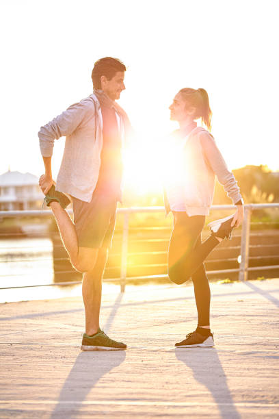 istock Couple exercising outdoors 1288561311