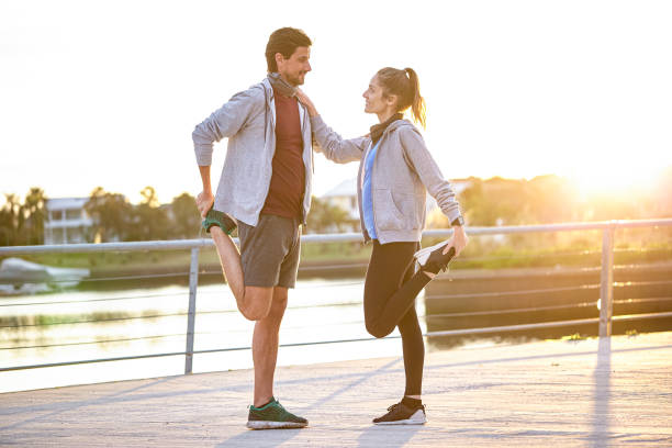 istock Couple exercising on boardwalk 1288561324