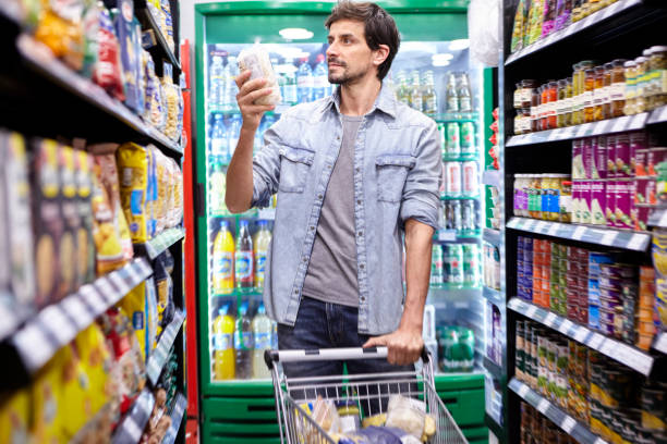 istock Man shopping in supermarket 1288561423