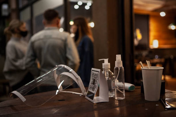 istock Hand sanitiser and sneeze guard 1288561448