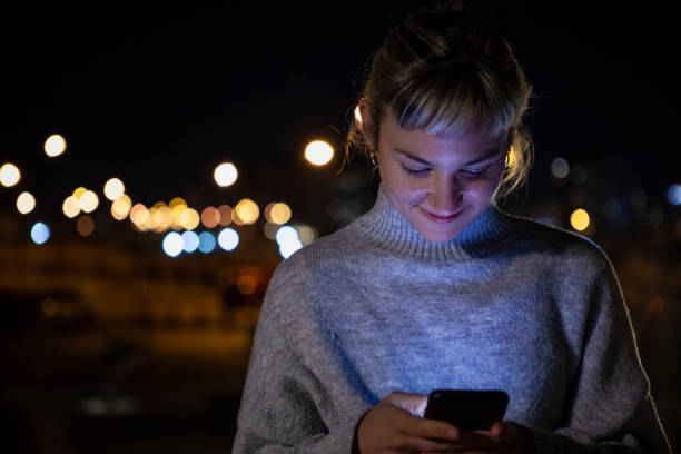 istock Woman using smart phone at night 1288561460