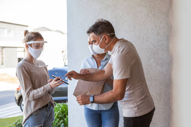 istock Couple receiving parcel 1288561857