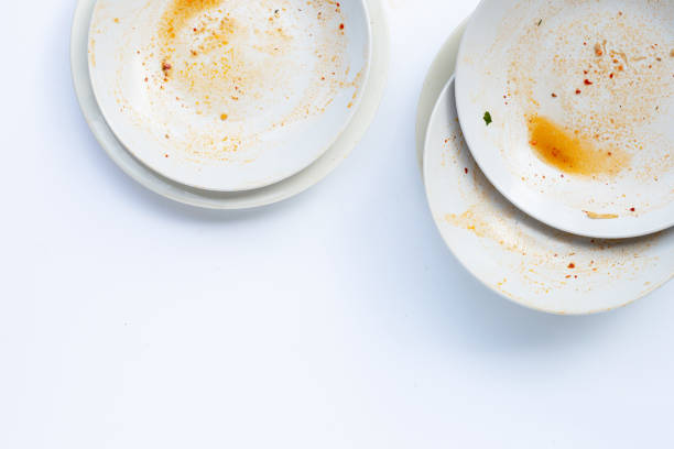 istock Dirty dishes on white background. 1288563966