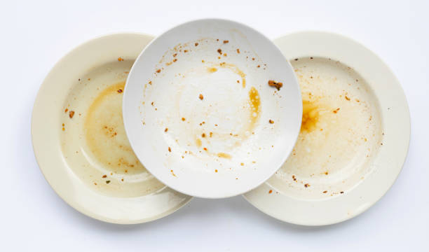 istock Dirty dishes on white background. 1288564082