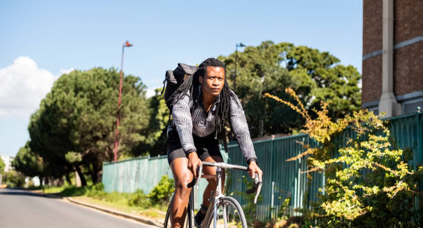 istock Man with backpack cycling outdoors 1288564422