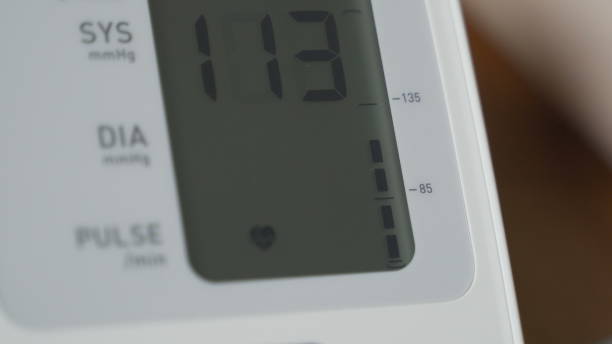 istock Woman measures her blood pressure 1288566192