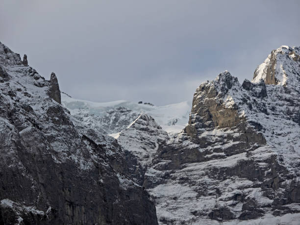 Snow-covered rock walls and glacier ice