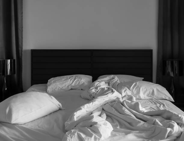 istock White towels on bed decoration in bedroom with pillows. 1288571122