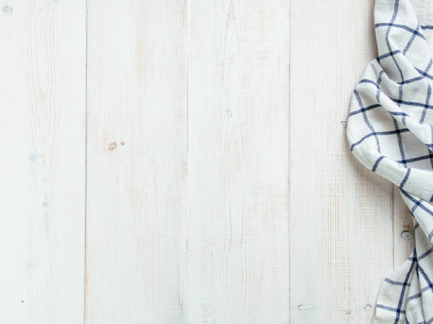 istock Blue tablecloth on white wooden table 1288573435