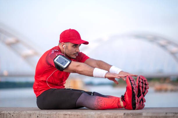 istock Young sportsman preparing for running 1288574763