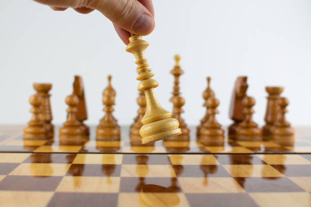istock check the white king on the chess field 1288579209