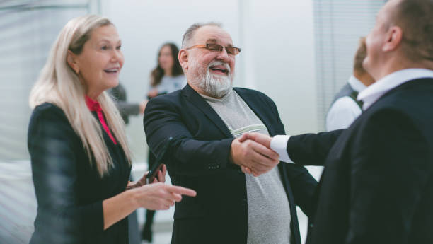 istock close up. friendly business partners shaking hands 1288579461
