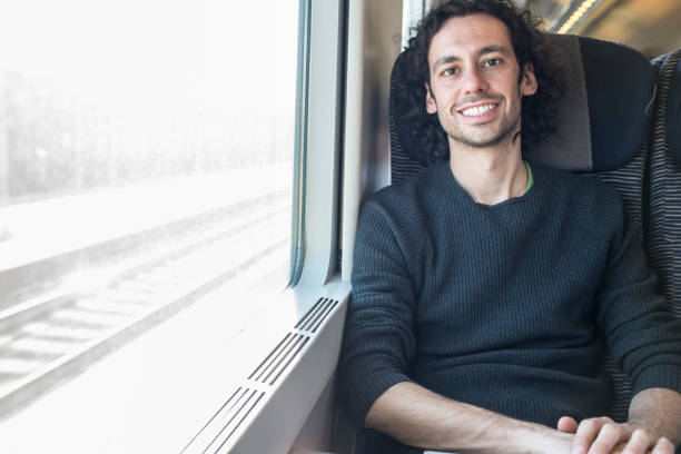 istock young man traveling on a train 1288579519