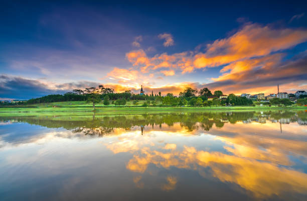 istock Dawn by the large lake with impressive clouds reflecting 1288579698