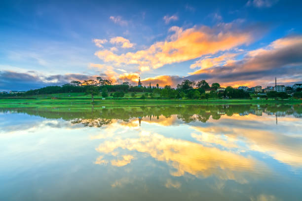 istock Dawn by the large lake with impressive clouds reflecting 1288580293