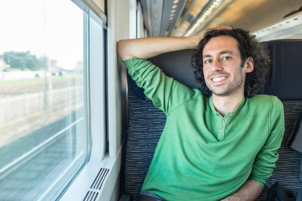 istock young man traveling on a train 1288580600