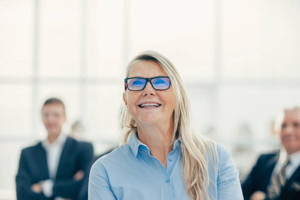 istock close up. successful business woman looking forward 1288581254