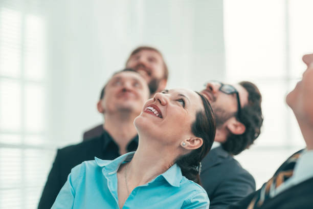 istock close up. a group of successful entrepreneurs looking up 1288581301