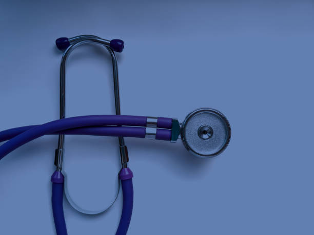 istock Lilac medical stethoscope close up on monochrome background 1288581929