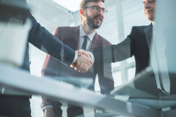 istock close up. image of a confident handshake business partners 1288582358