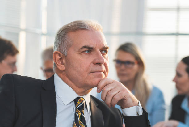 istock close up. confident adult businessman looking forward 1288582432